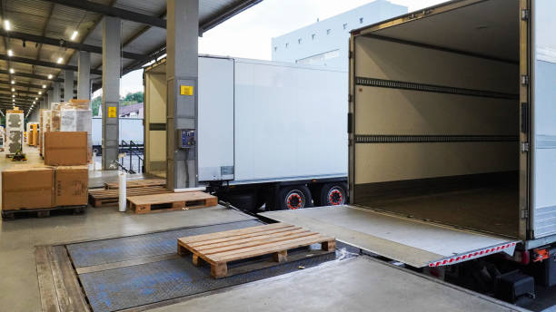 Empty truck at a warehouse loading dock ready for cross-docking pallets.