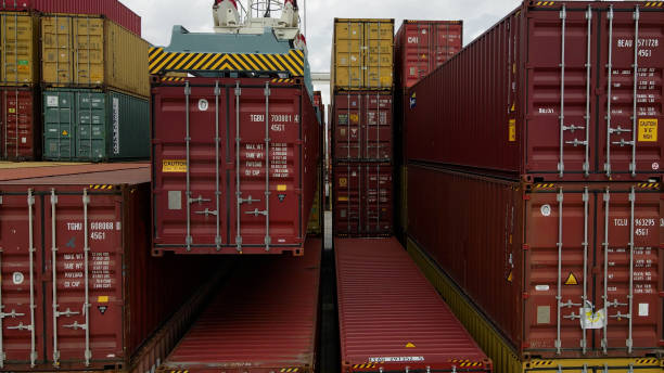 Shipping containers at port illustrating break bulk vs cross docking logistics.