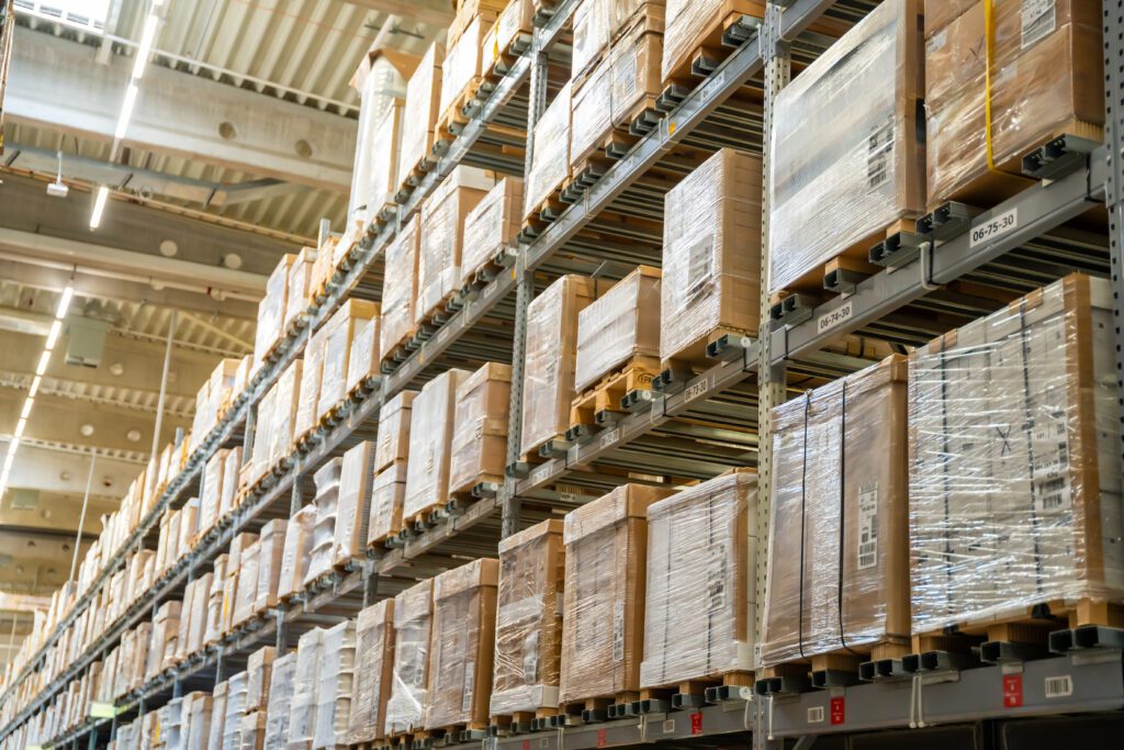 Warehouse filled with palletized inventory during peak shipping season showing warehouse overflow solutions in action